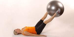Holding a gym ball between your raised legs develops lower pressure